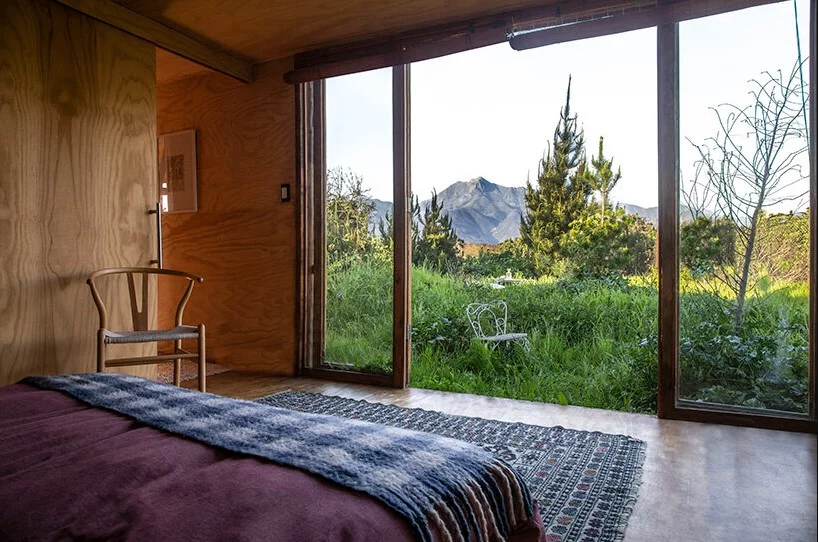 The master bedroom boasts double glass sliding doors, once again expanding the space to the outdoors