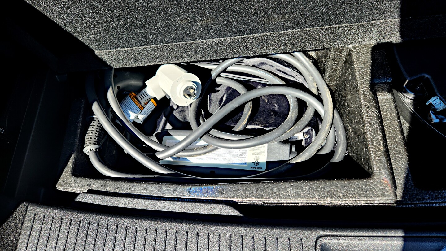 Nissan EVs come with a standard charging cord that can plug into any household 120V outlet and, with a twist of the head to swap plugs, into a 240V as well