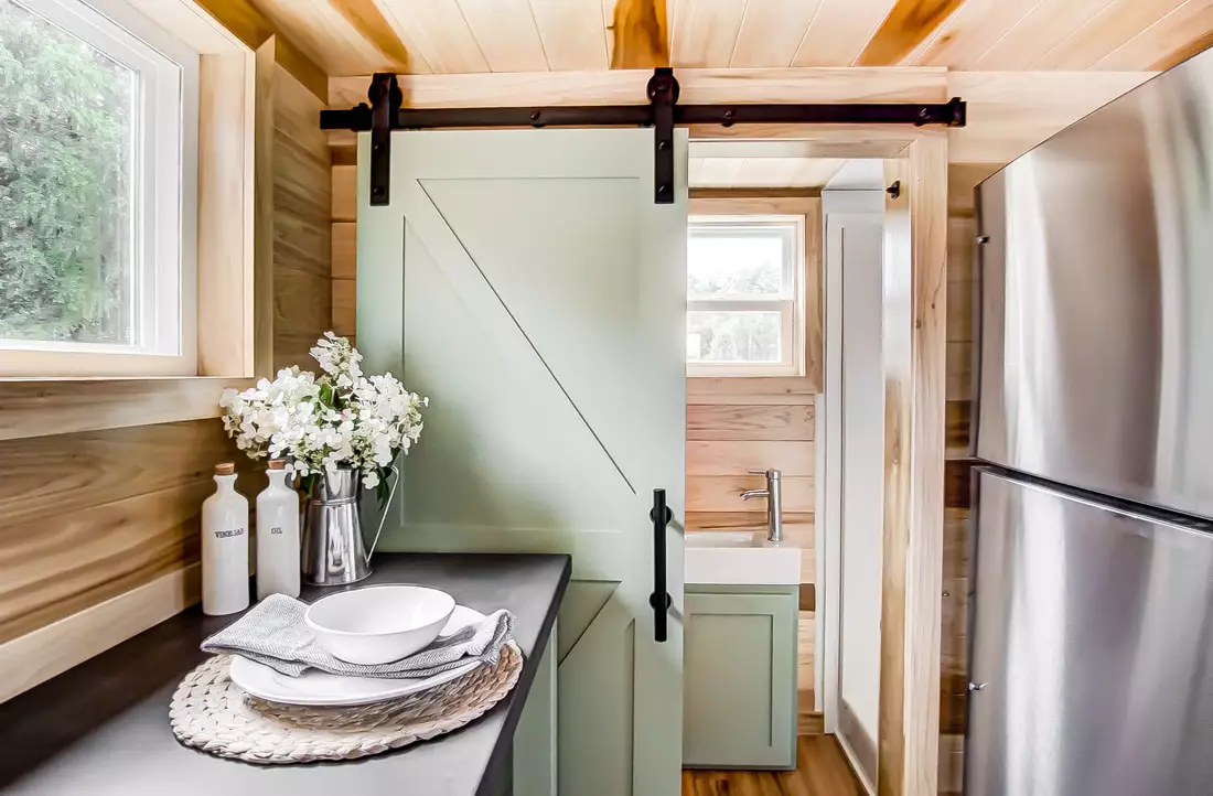 The Clover's bathroom is accessed by barn-style sliding door