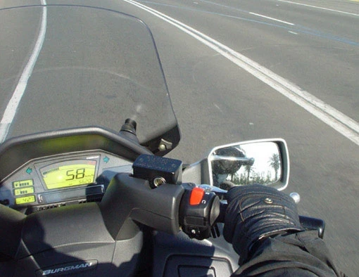 Riding the Burgman is ridicuously good fun. The 650 twin has enough power to ensure a surfeit in any roadgoing situation. It's not all that long ago that Triumph's 650 twin was considered the king of the road. Now a similar motor with a similar power spread powers a scooter.