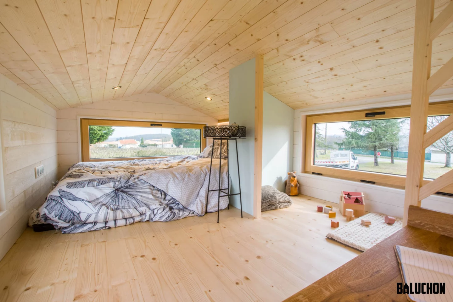 The Chicorée's loft area includes a smaller sleeping area and play area for a child