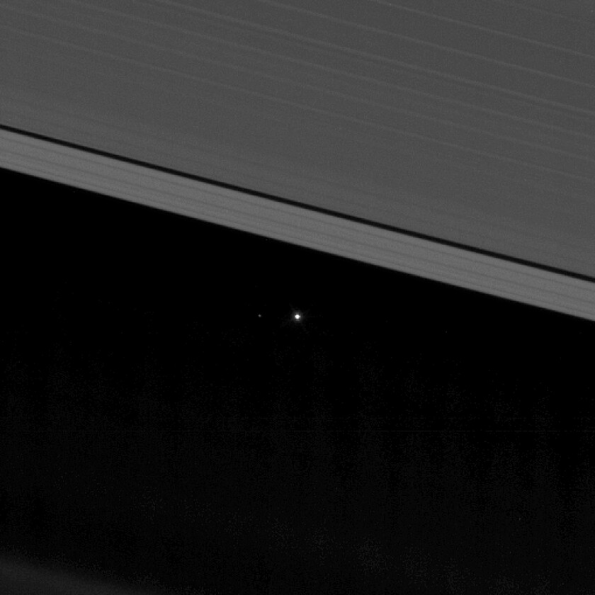 A closer crop reveals our Moon to the left of our planet