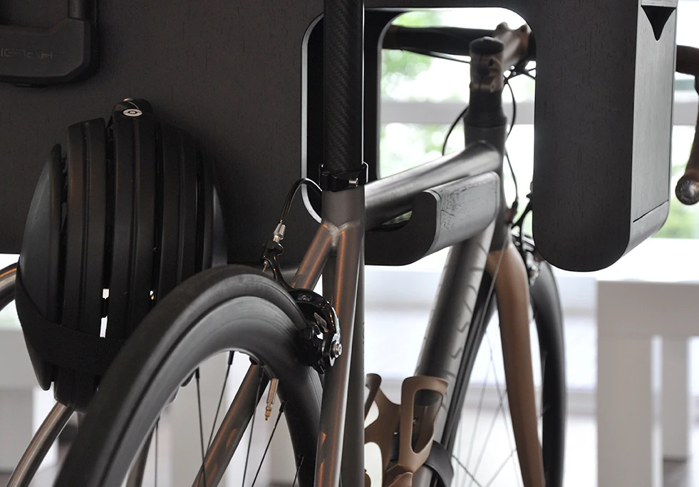 Bike Butler is made from mulch-layered birch with beech-wood veneer and a stainless steel tube-shaped base