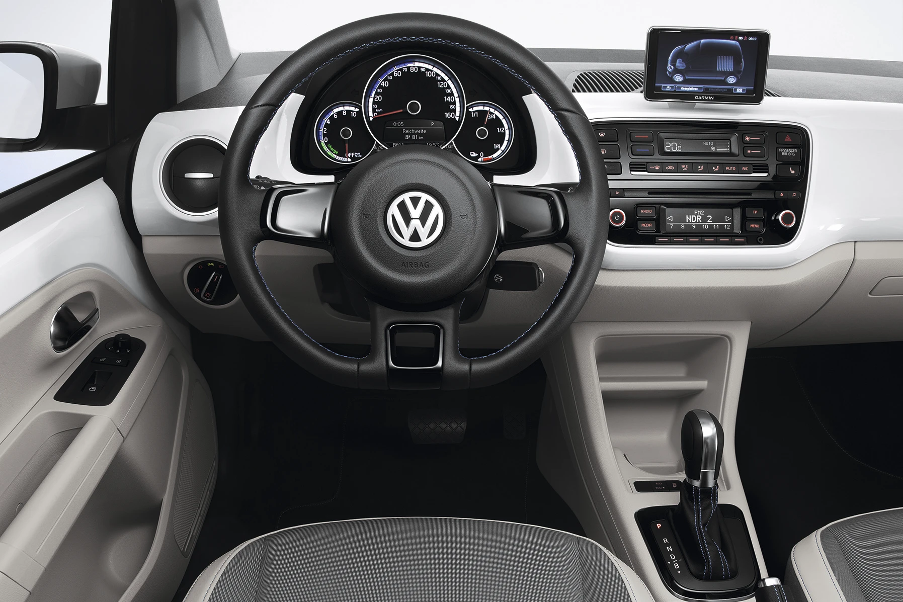 The interior includes chrome and leather accents