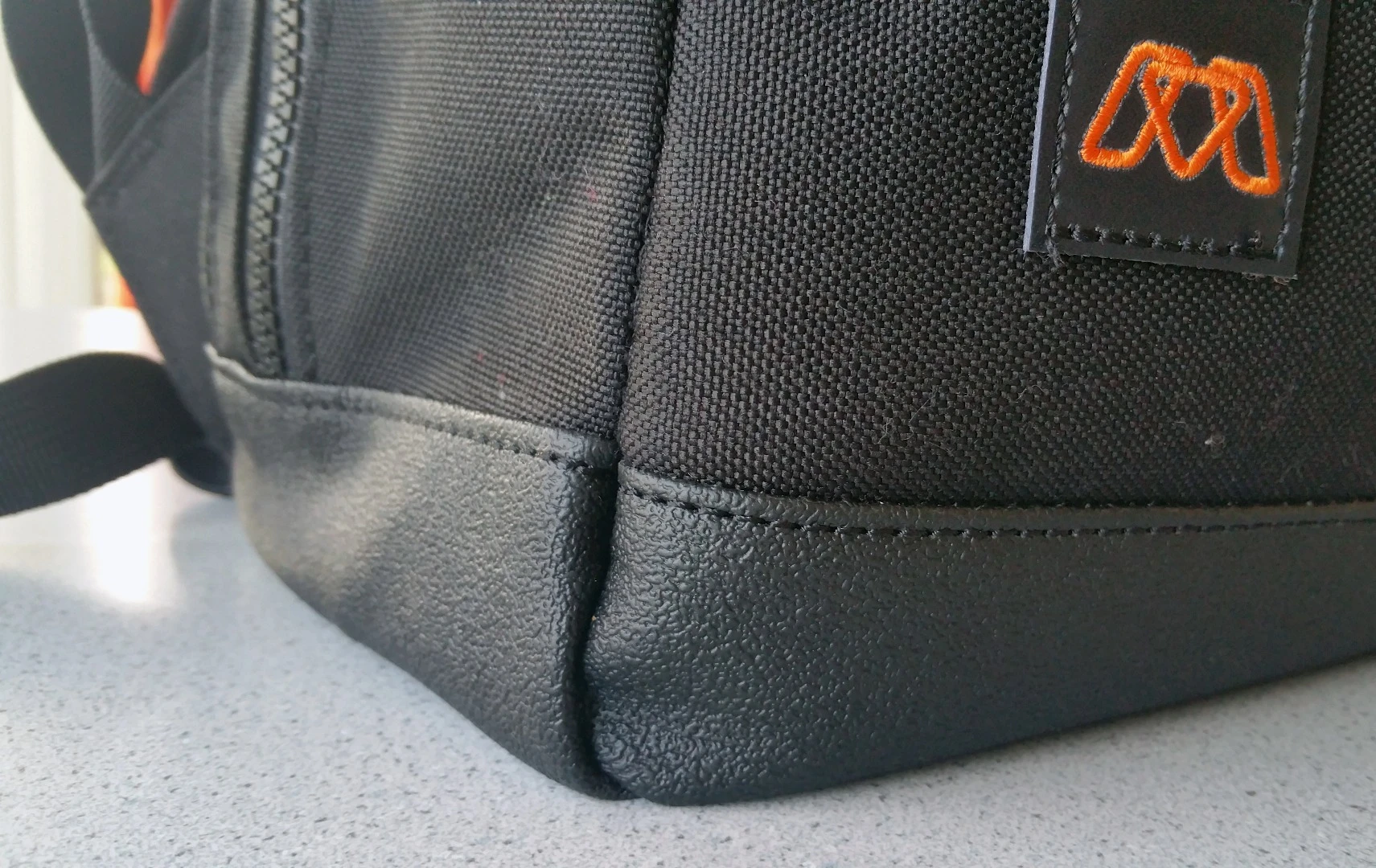 The MOS Pack has a rubberized bottom that helps prevent scuffing/damage and water ingress