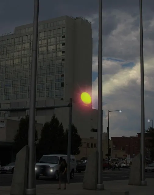 Adam Frank's SUNLIGHT rising up the side of Denver's Minoru Yasui Building