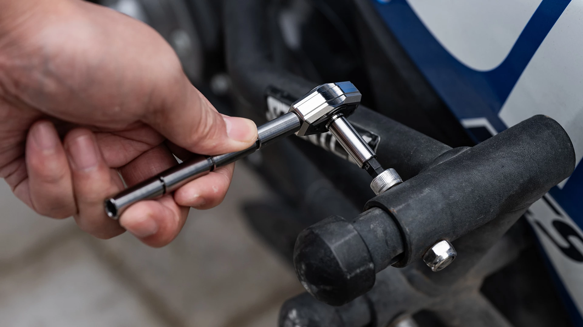 The ratchet in a L configuration, which can use either the long or the short end for the driver