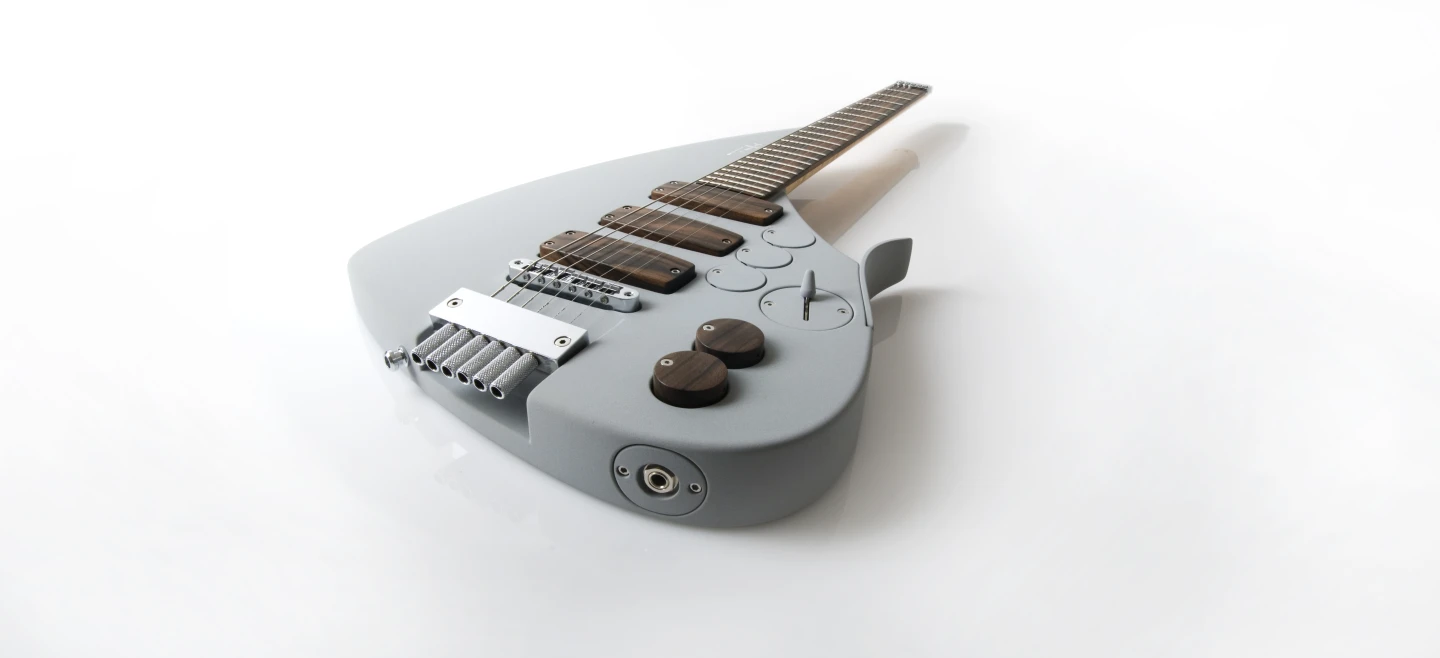 The pickups and controls of the Tesla Prodigy are covered in exotic wood
