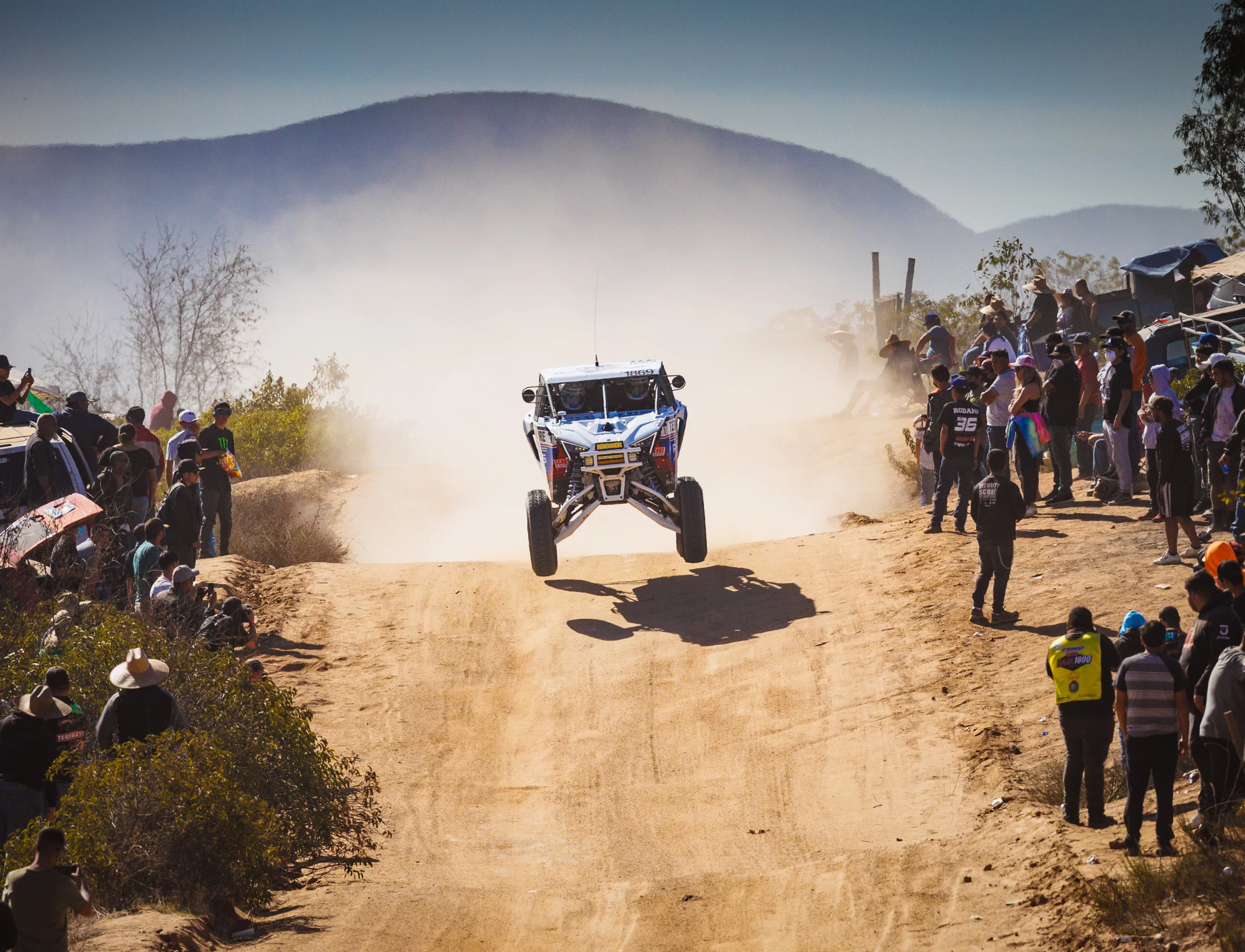 The RZR flies over a crest