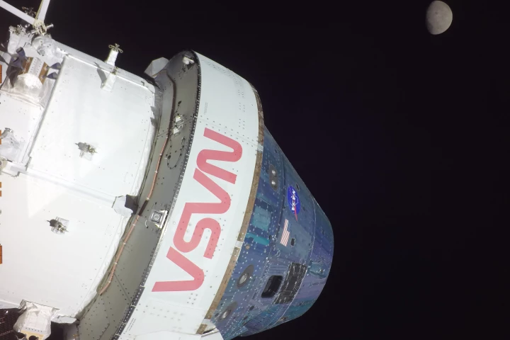 The Orion spacecraft taking a selfie of itself and the Moon