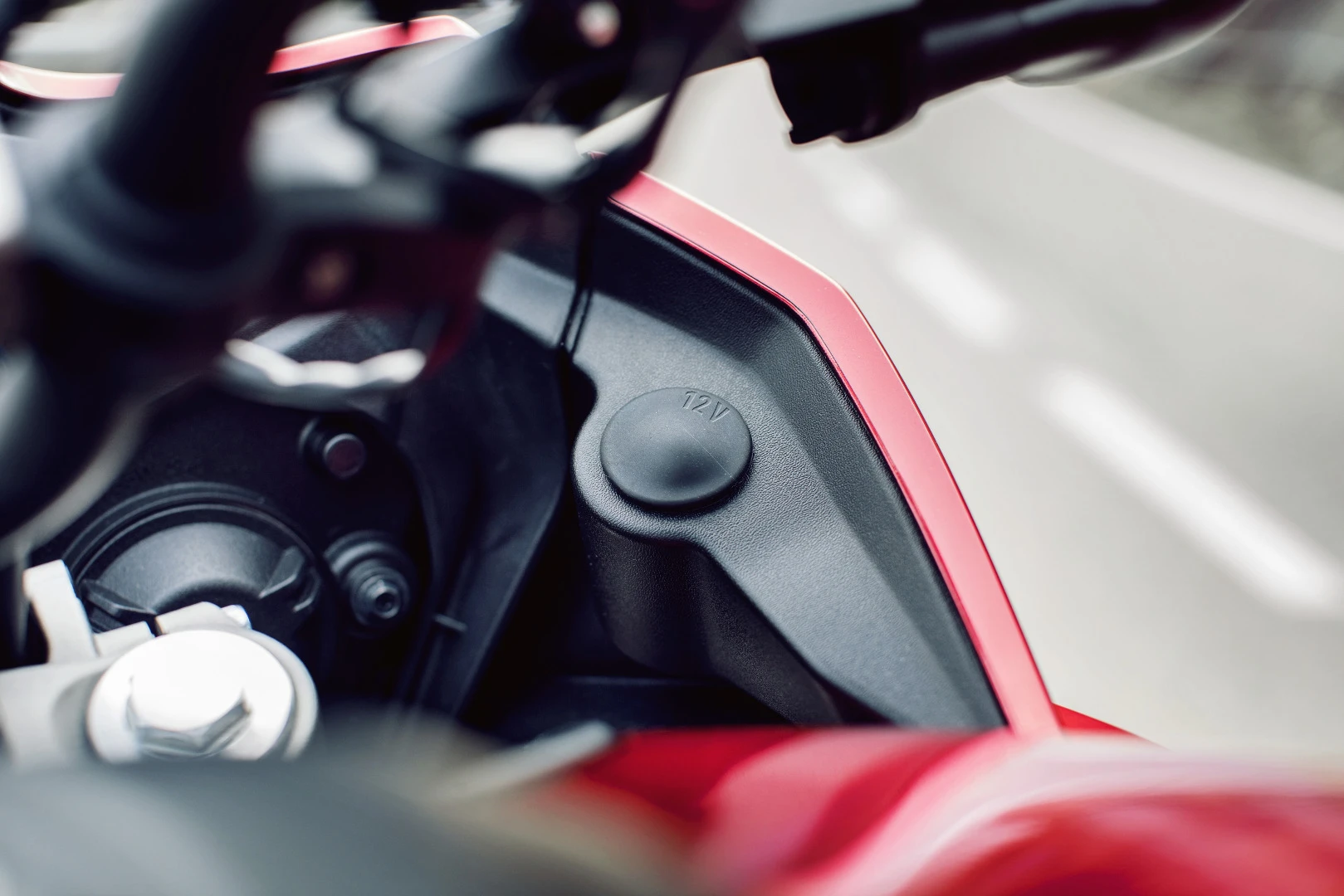 A 12V outlet sits on the right-hand side of the Yamaha Tracer 700