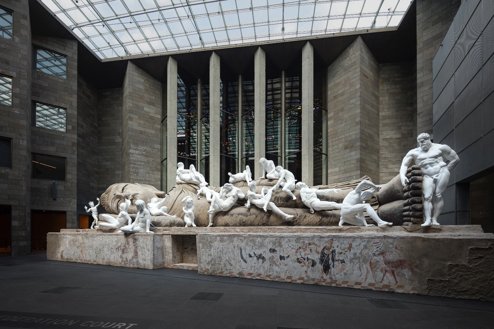 Installation view of Xu Zhen Eternity - Buddha in Nirvana, the Dying Gaul, Farnese Hercules, Night, Day, Sartyr and Bacchante, Funerary Genius, Achilles, Persian Soldier Fighting, Dancing Faun, Crouching Aphrodite, Narcissus Lying, Othryades the Spartan Dying, the Fall of Icarus, A River, Milo of Croton 2016 – 17 on display at NGV Triennial at NGV International, 2017