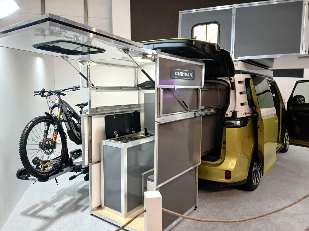 Double origami camper cube brings bathroom and king bed to small vans