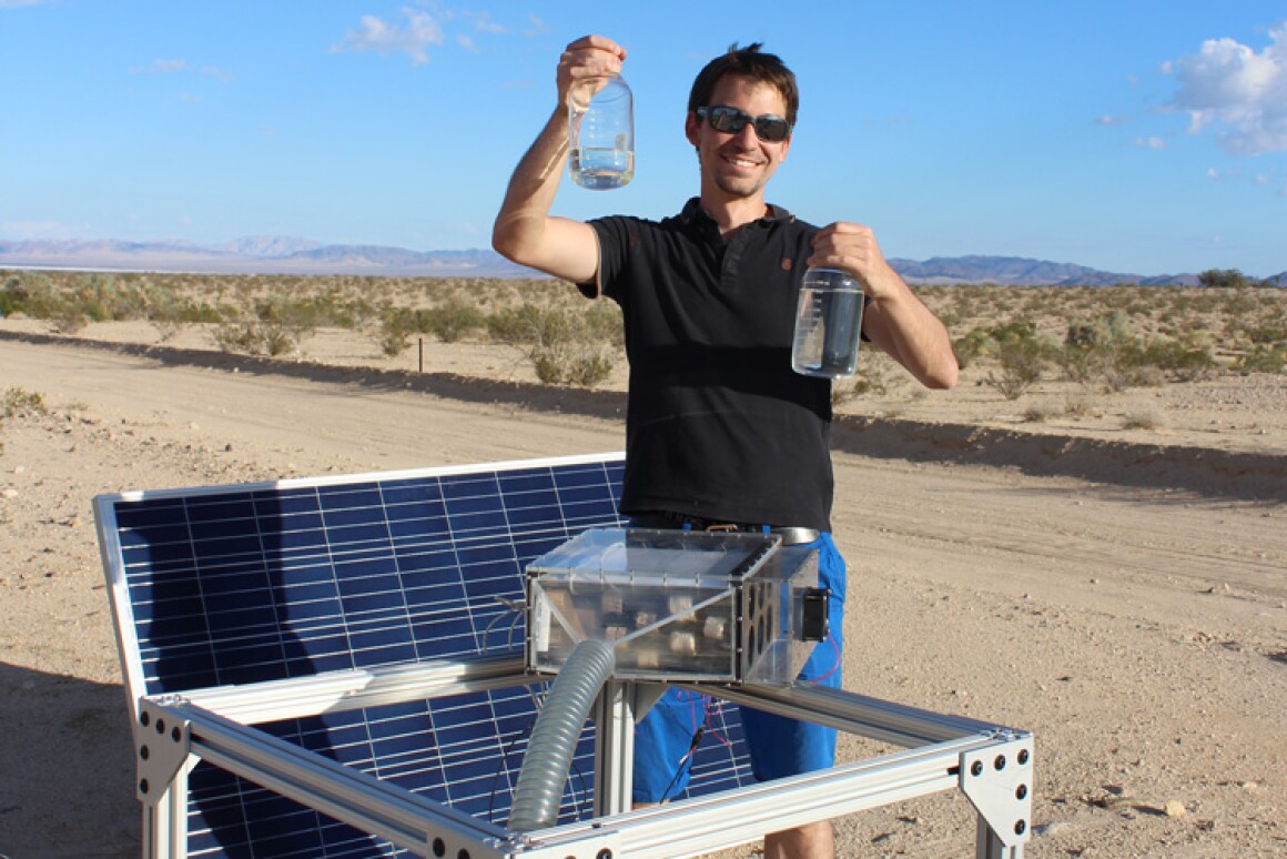 Researcher Mathieu Prévot with water collected from the new device that can wring water out of even very dry air