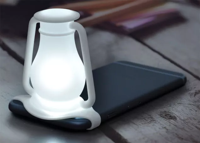 Travelamp is attached to your phone via a silicone strap, which keeps it in place over the camera's flash