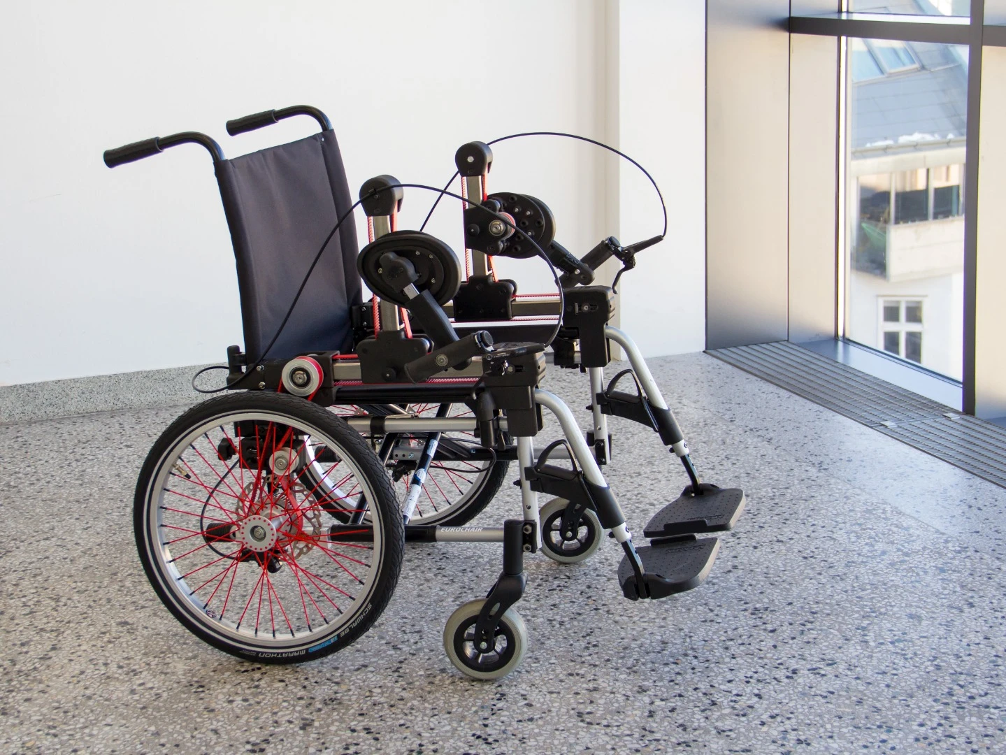 The wheelchair features dual drive cranks, and dual disc brakes