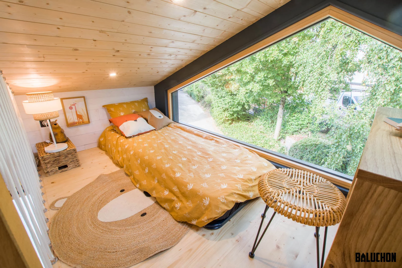The Gaïa Tiny House's secondary bedroom includes a single bed