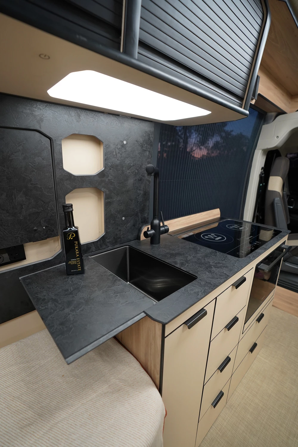 The sink cover slides over the basin to create a clean, flush countertop and slides off for sink access and use as an extension