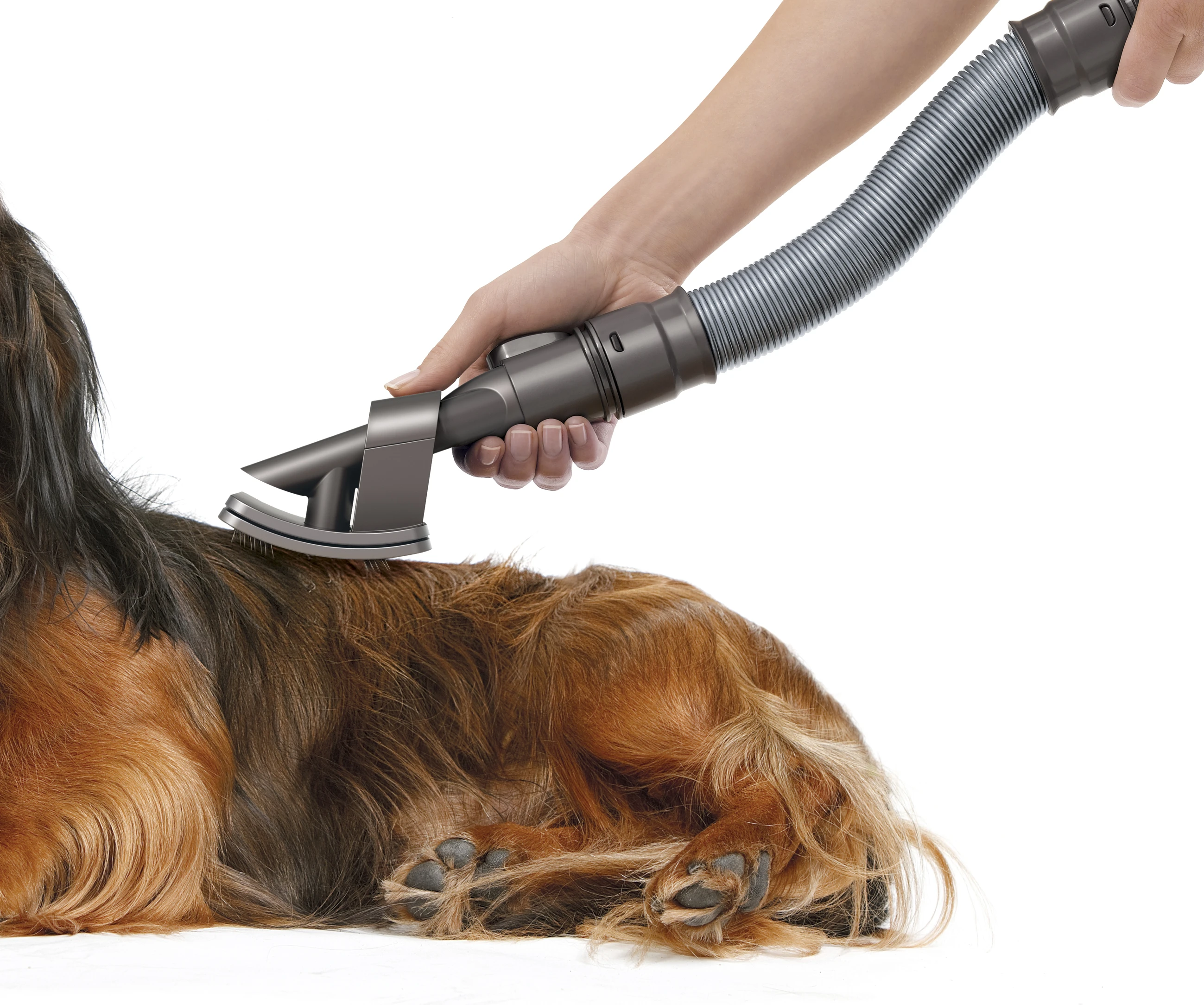 The bristles are angled at 35 degrees and any dead skin cells that get disturbed during grooming are captured by a nozzle near the spring-loaded brush adjustment mechanism