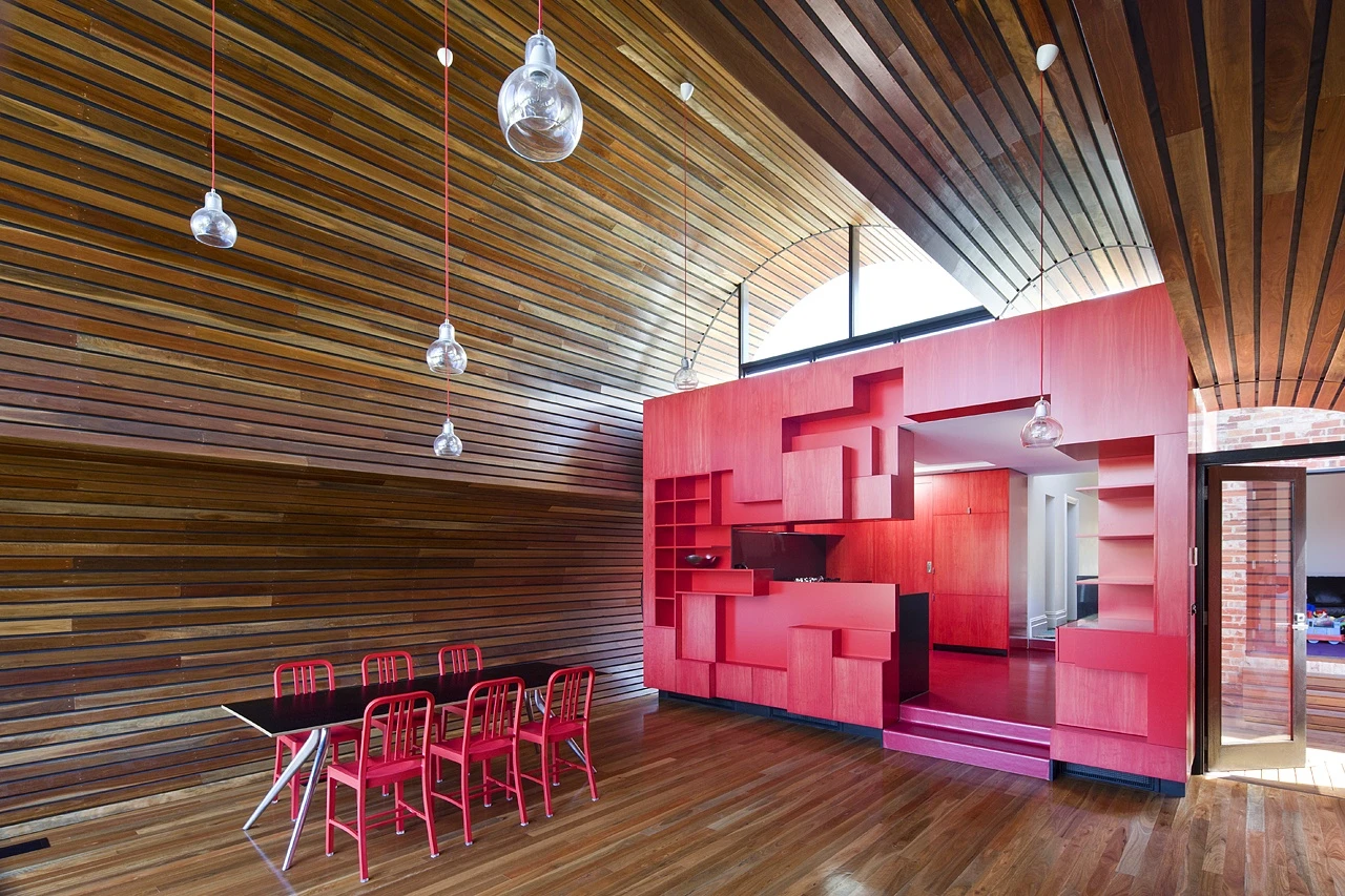 Nested within the cloud-shaped extension is a red cube: the Cloud House's new kitchen
