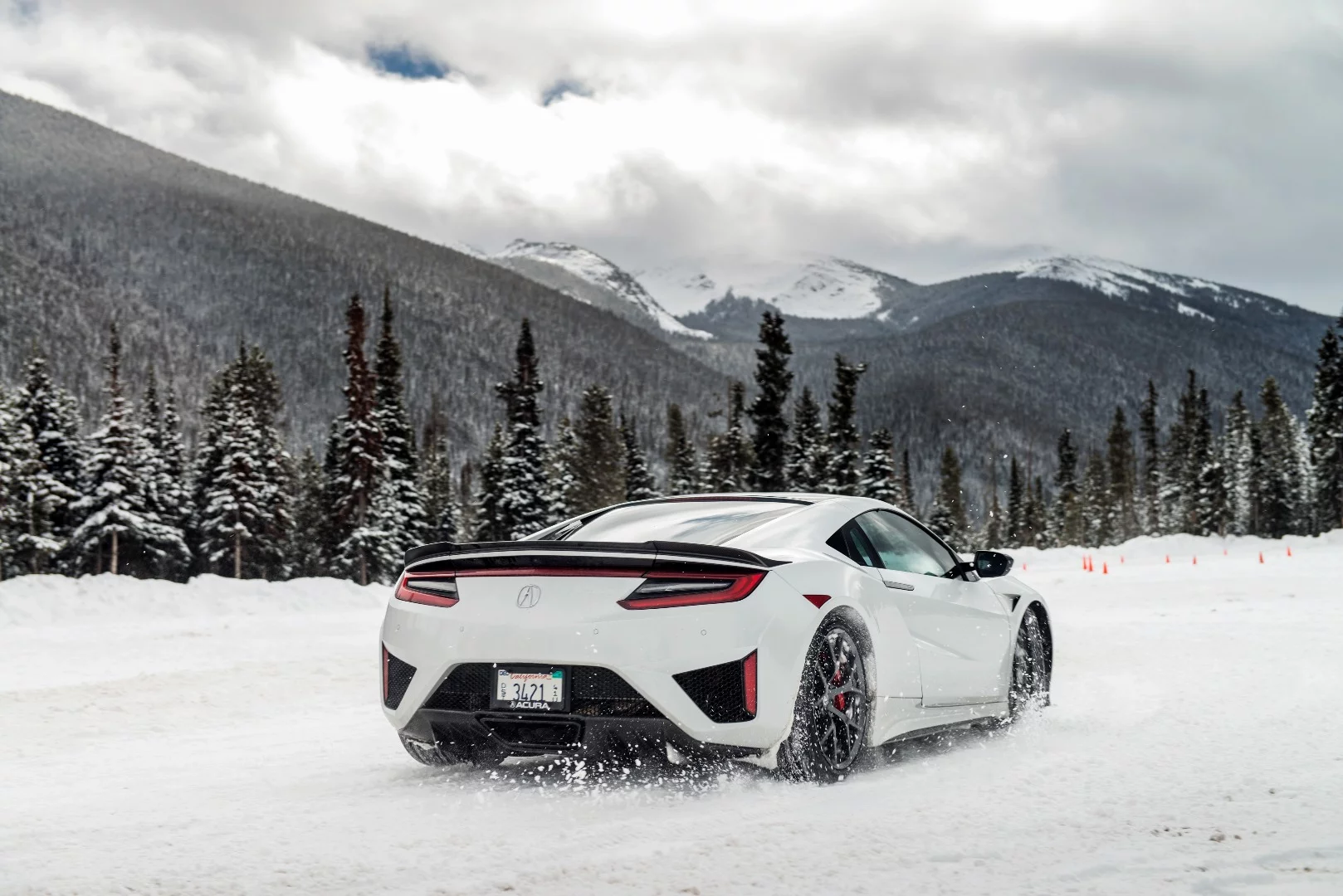 Although designed to move a lot of air around and over it, the low profile of the Acura NSX did not stop it from putting a lot of rubber to the snow on our course