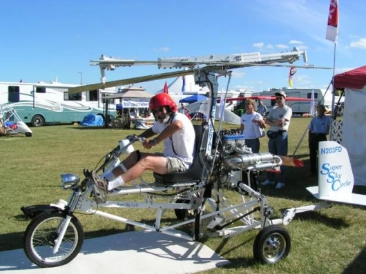 An enthusiastic punter gets a feel for the Super Sky Cycle
