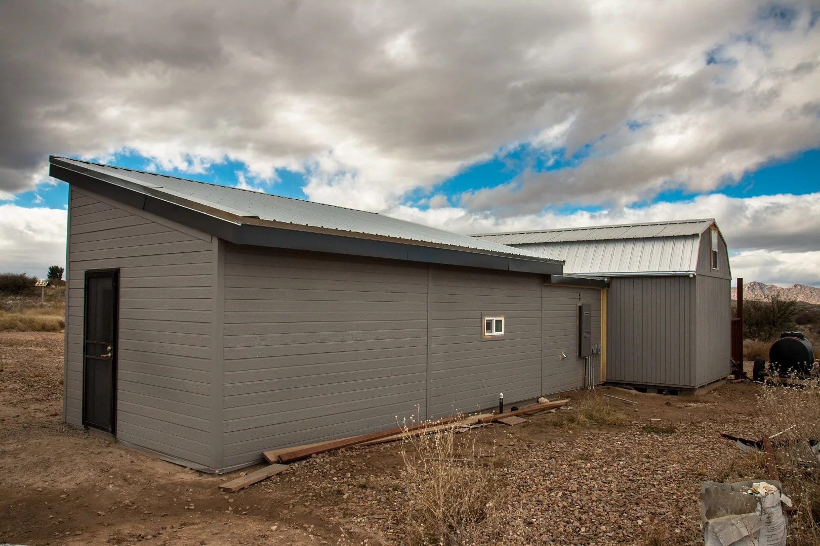 The rear of the tiny home addition. It lacks many windows for higher efficiency.