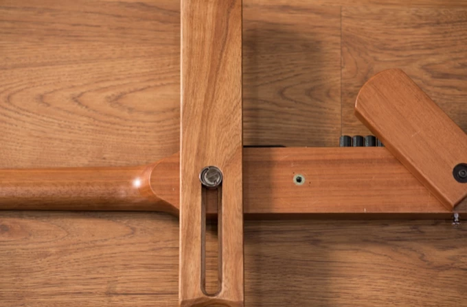 The main rotating arm of the Cross Guitar 2.0 has a hollowed out track that can be adjusted for fit without needing tools, and can also be used to mount a smartphone to the instrument