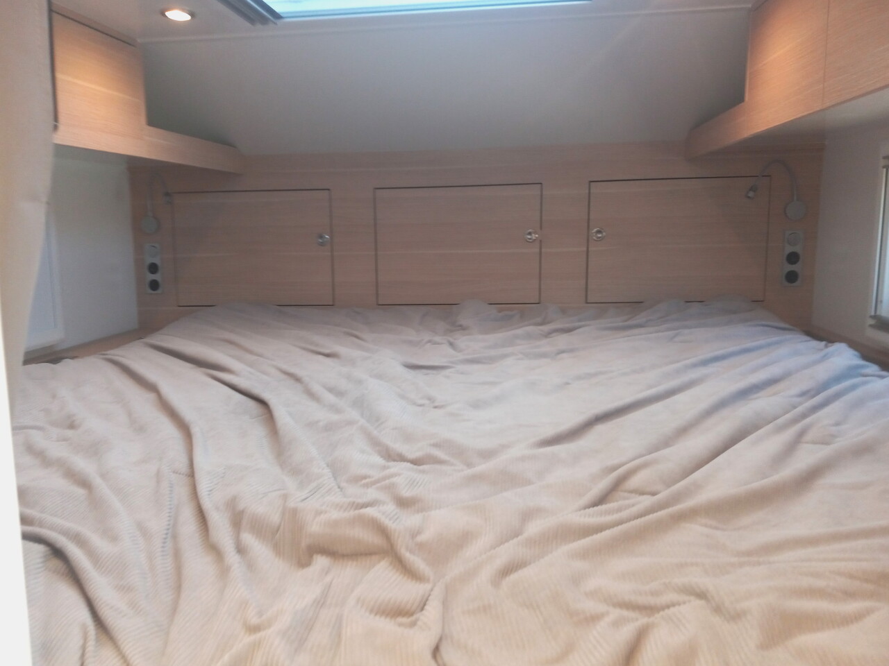 The alcove fits a proper king-size bed and still has room to surround it with HVAC vents