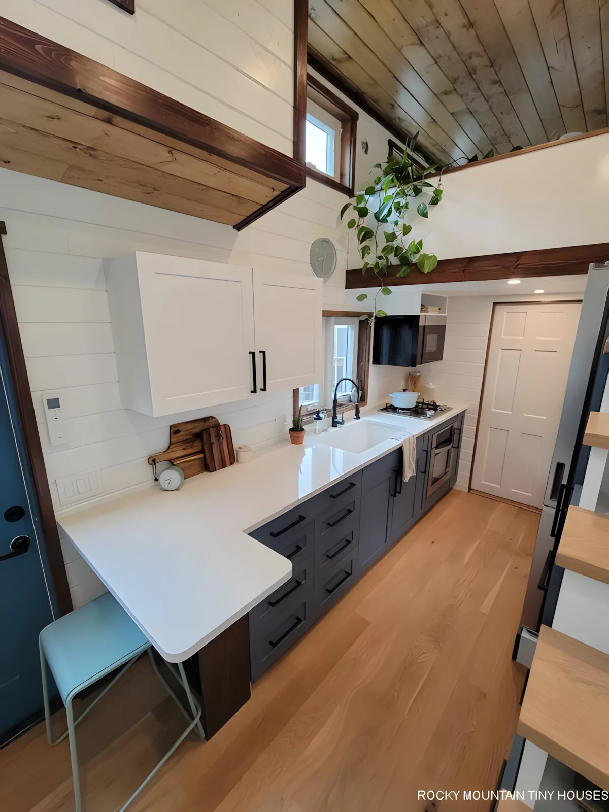 The Bandelier's kitchen looks spacious and includes an oven, full-size fridge/freezer, sink, microwave, and cabinetry