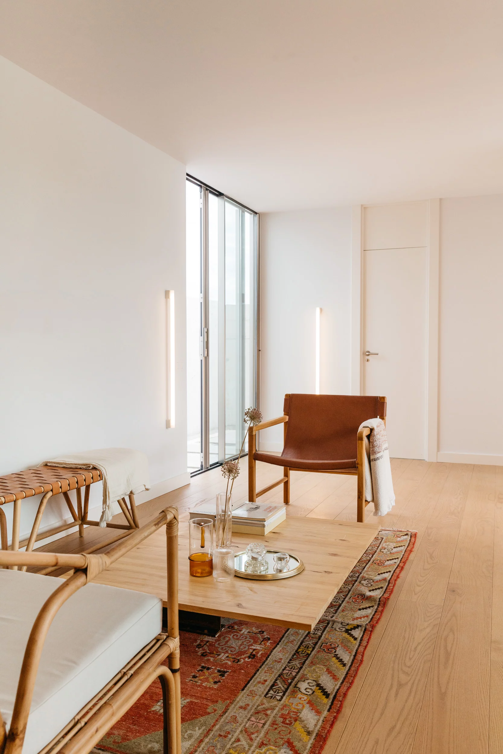 The Tini 2M's interior layout is centered around a large living space with a dining area/lounge and a kitchenette