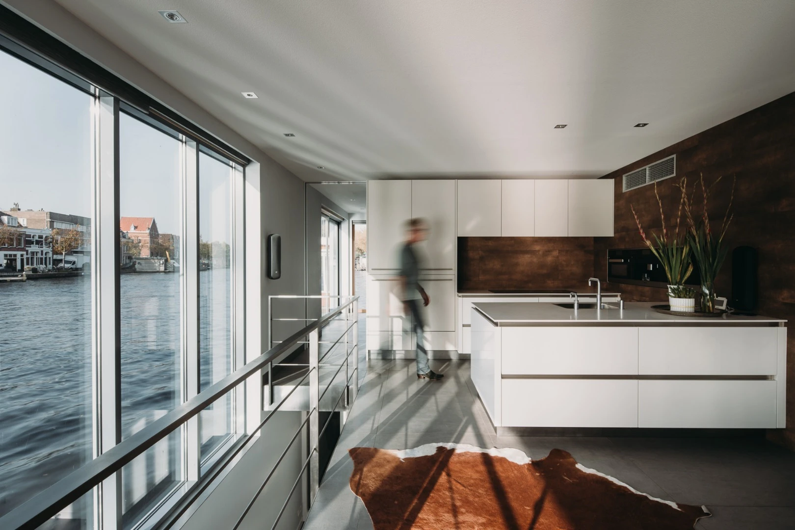 The Haarlem Shuffle features a streamline modern kitchen with open dining area