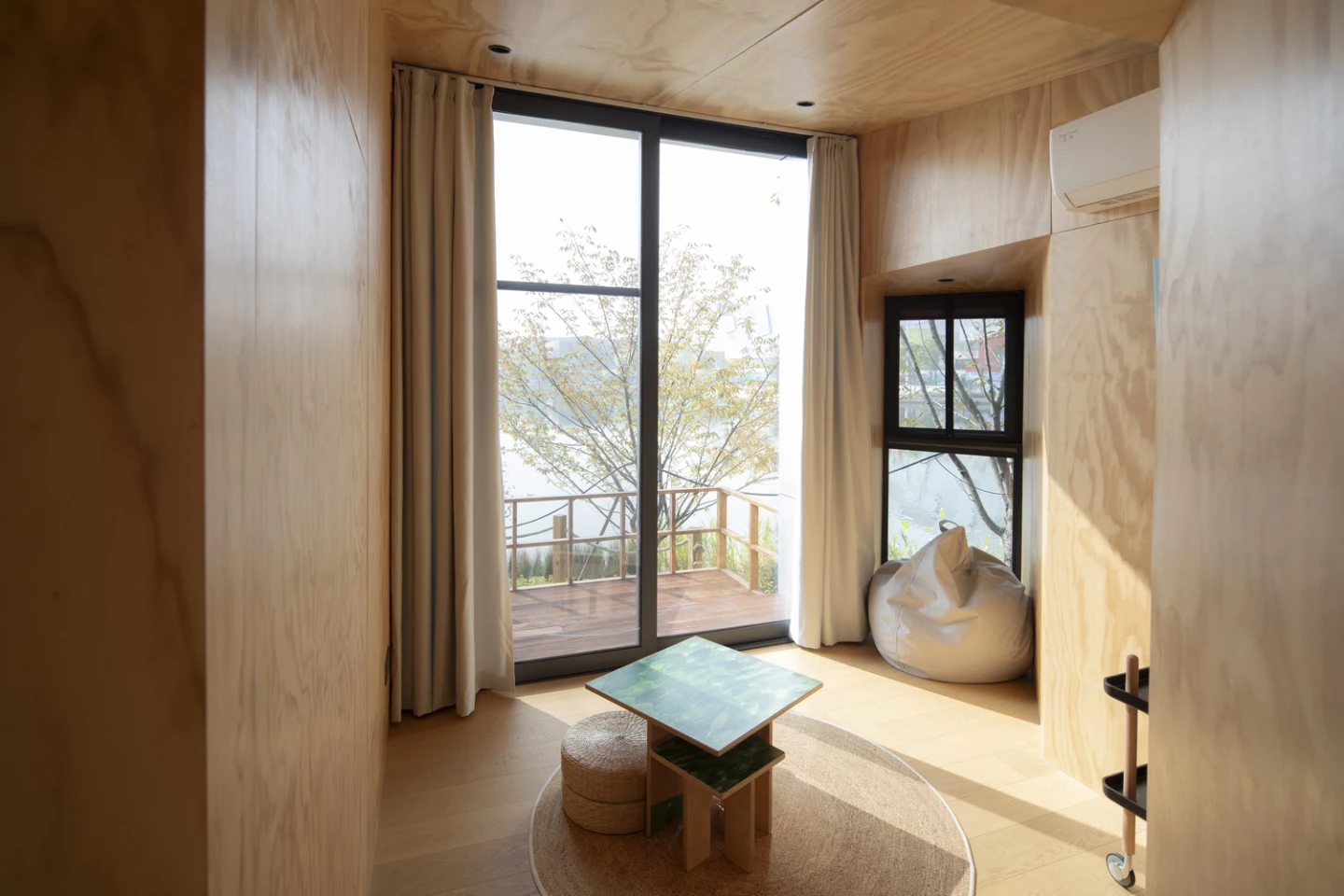 Inside Cabin of Maze, natural textures and minimalist design create a serene retreat
