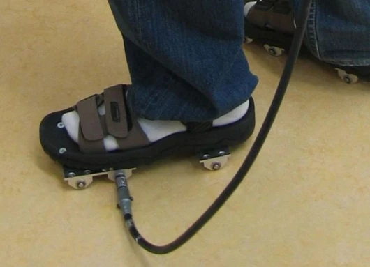 The shoes operate like reverse roller-skates