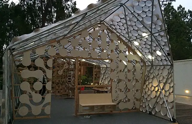A prototype of the Backyard BI(h)OME, an affordable, low impact and recyclable dwelling that can be easily put together in people's back gardens thanks to its simple construction using fabric sheeting embedded with solar panels wrapped around a framework of electrical conduit pipes