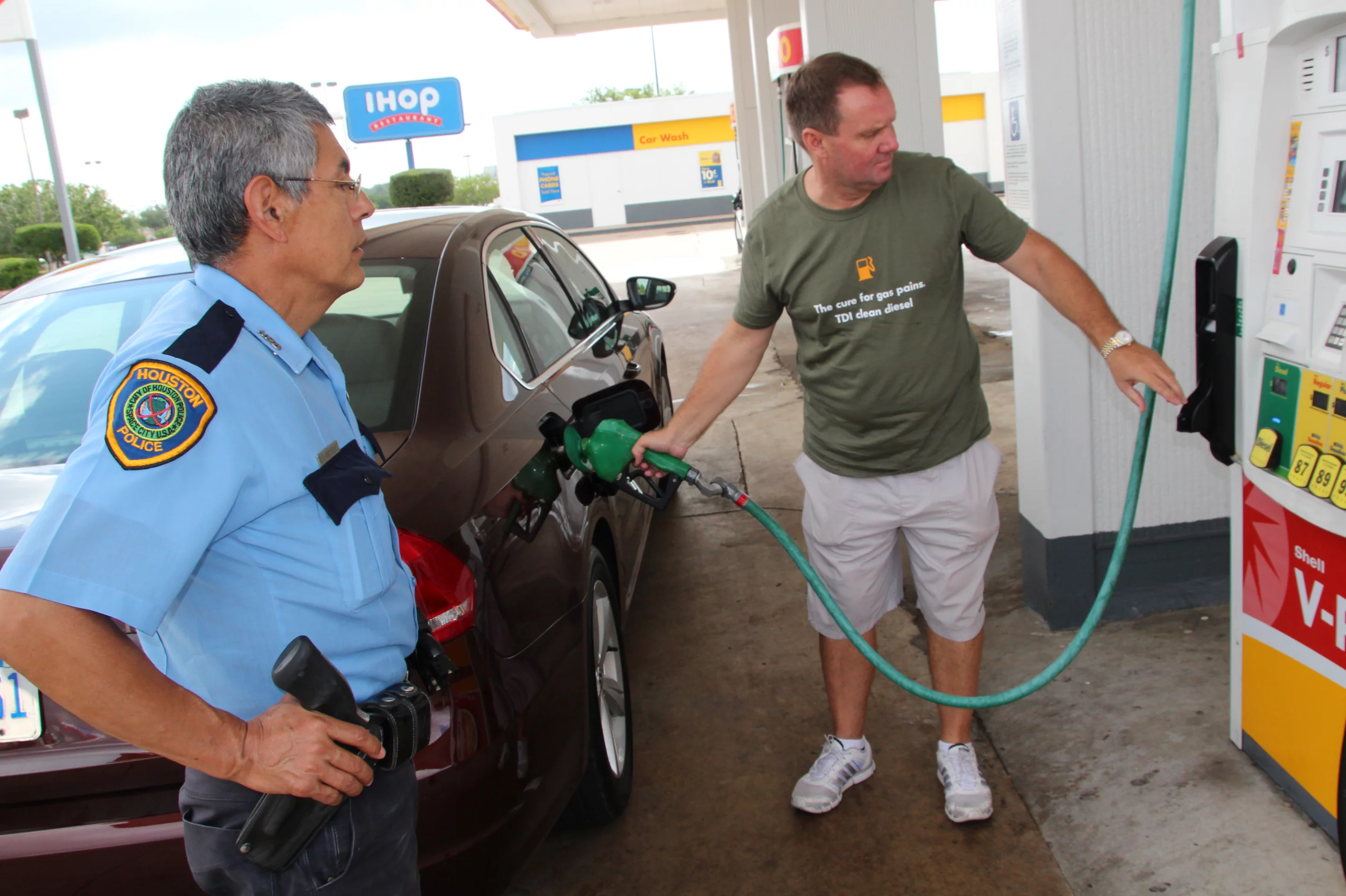 John Taylor fills up under the watchful eye of Houston law enforcement