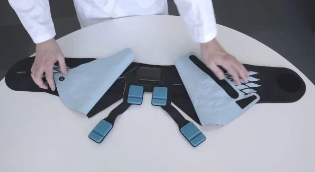 Lumbia looks quite a bit like a conventional back brace, although it contains a series of sensors and activators that make direct contact with key areas of the patient’s lumbar region
