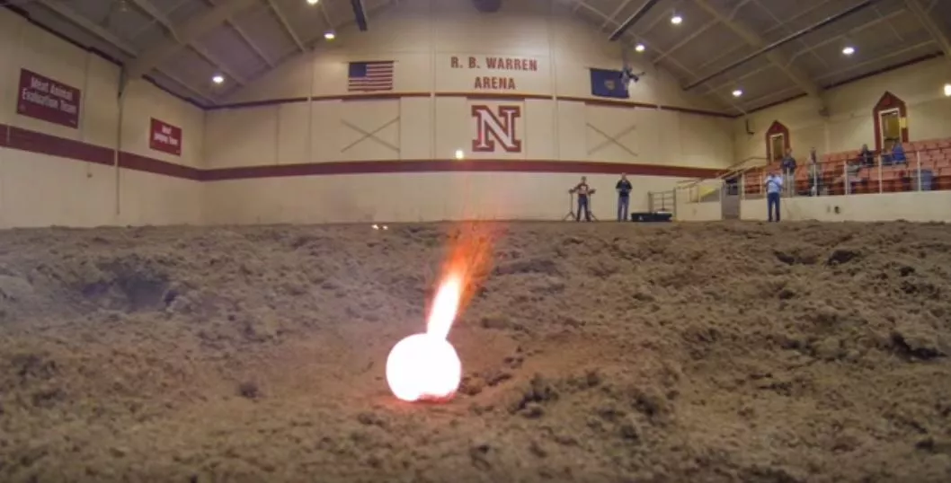 A ball ignites seconds after being dropped