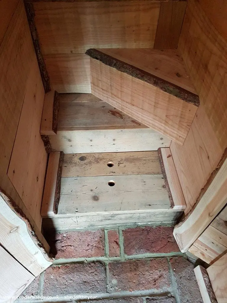 Steps and a trapdoor lead from the Mushroom House's ground floor to upper floor