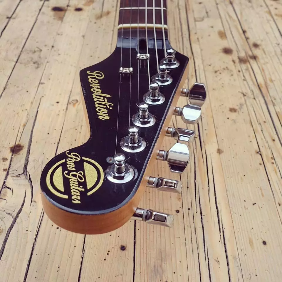 The Strat-like headstock of the Revolution's Jan body core