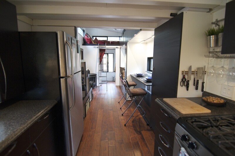 The main corridor and living space are large enough for multiple people to be moving around