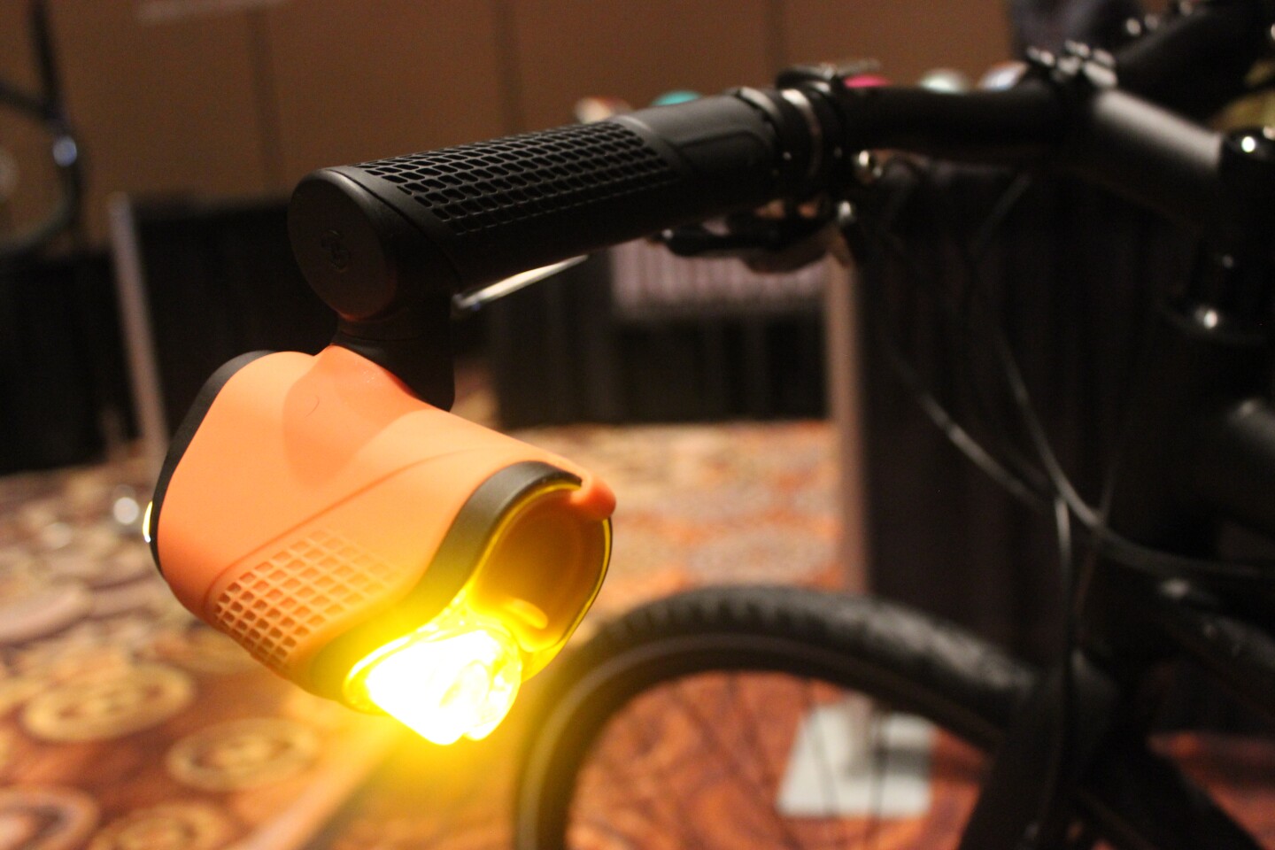 The Brightspark system takes the form of two handlebar grips, each one of which has an adjustable-angle lighting module hanging from its outside end