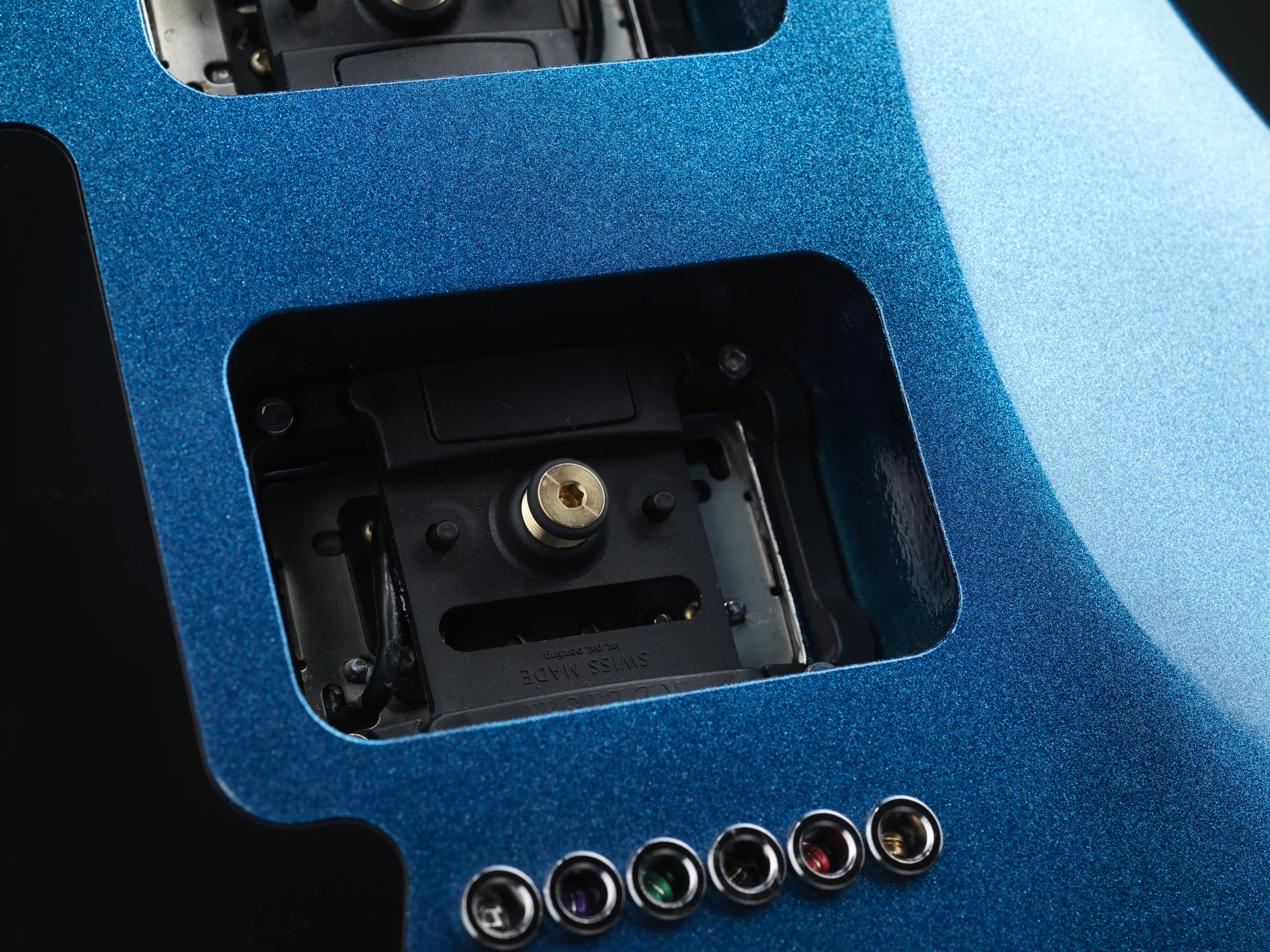 The pin in the middles allows for pickup height adjustment