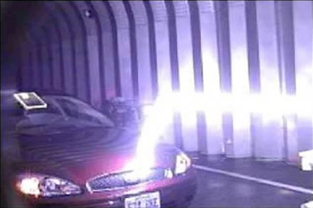 A lightning bolt travels horizontally down a plasma channel from the LIPC before deviating when it gets close to the target which offers a lower-resistance path to the ground (Photo: U.S. Army)