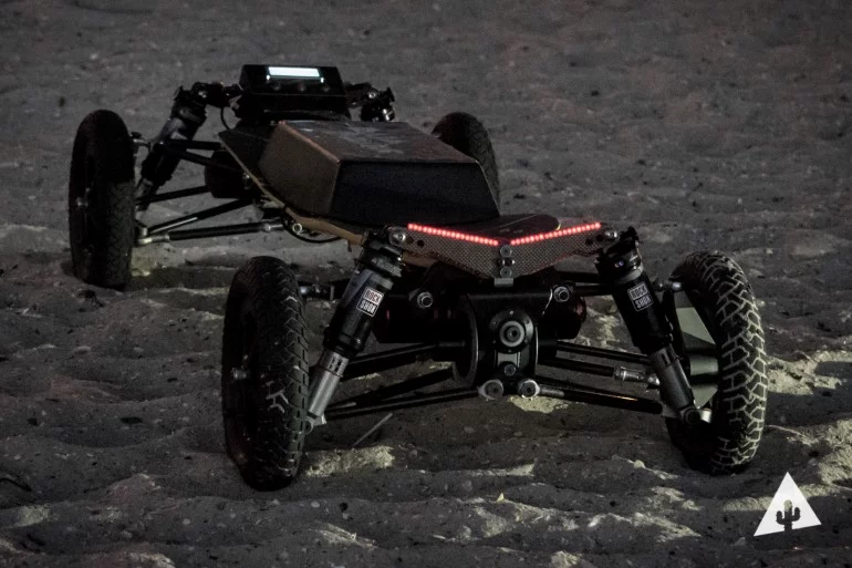 The BajaBoard has a carbon-Kevlar deck and carbon and aluminum chassis construction