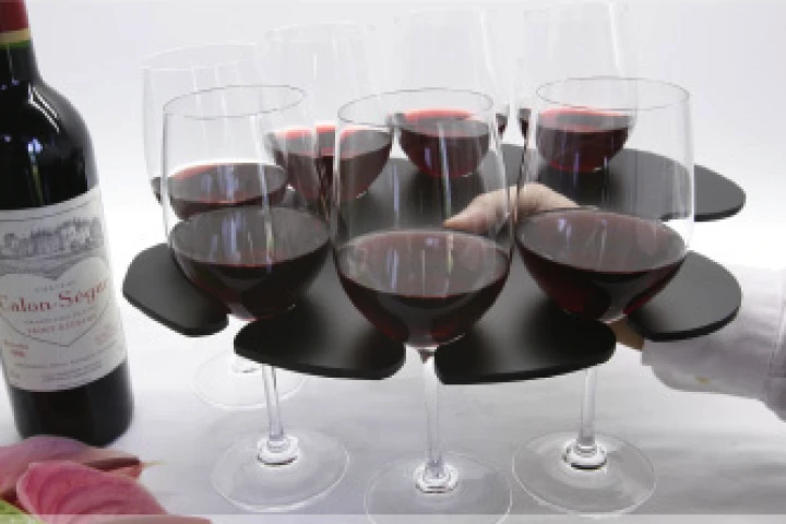The Stem Glass Tray holds eight wine glasses in balanced formation and has a hole for your thumb