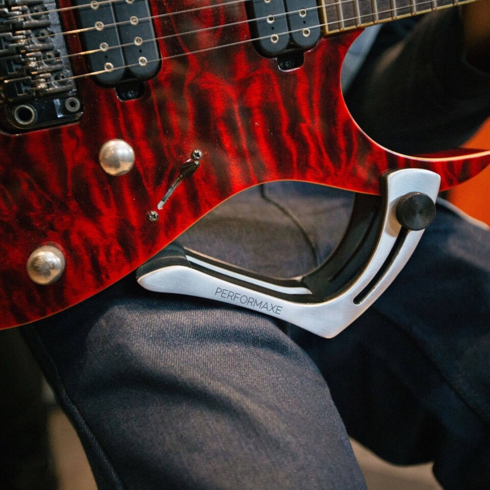 Performaxe clamps to your guitar to improve playing comfort