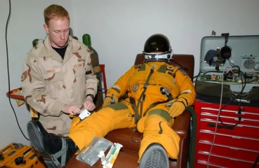 Maj. Mark Mount relaxes while he breathes oxygen before his flight in a U-2 Dragon Lady at a forward deployed location. U-2 pilots must breathe pure oxygen for an hour prior to take off to reduce the amount of nitrogen in their blood stream. This astronau
