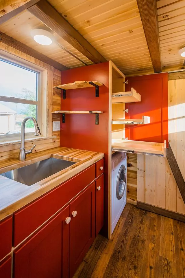 The kitchenette in Davis's 22 ft Off-Grid Tiny Home has lots of storage space