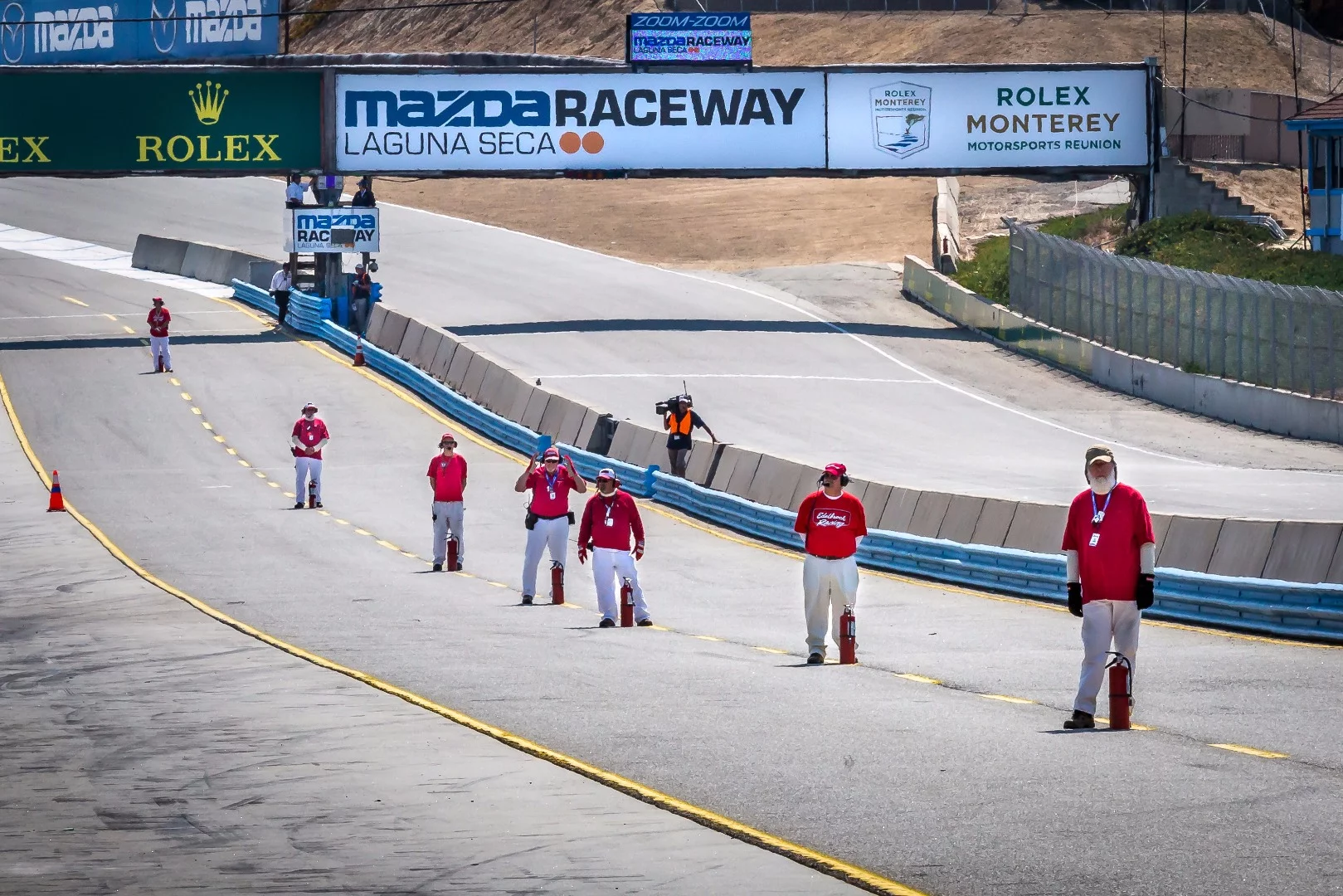 Course workers and volunteers play a significant role in pulling off events like the Rolex Monterey Motorsports Reunion